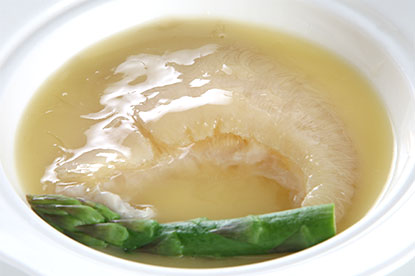 Shark Fin Soup (鱼翅汤) - a rich, golden broth served in traditional style
